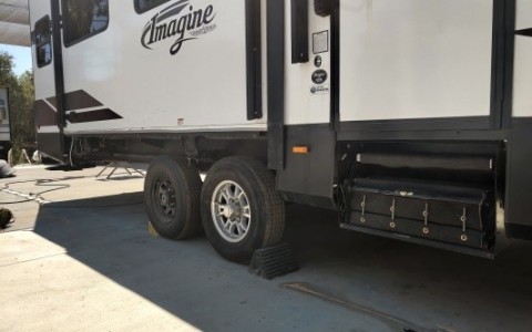 A tire blowout caused damage to the under belly and the side skirt